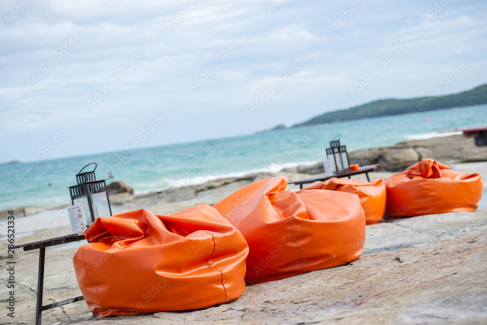 Fototapeta premium bean bag or sofa and table for restaurant on the beach