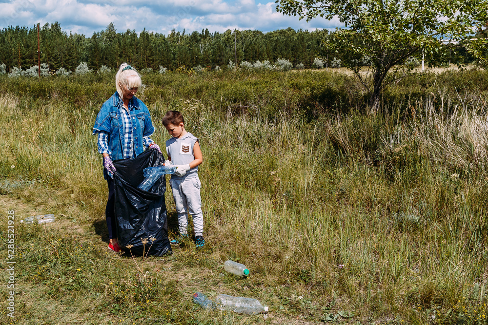 people volunteers do garbage collection in the forest. people volunteers do garbage collection in the forest.