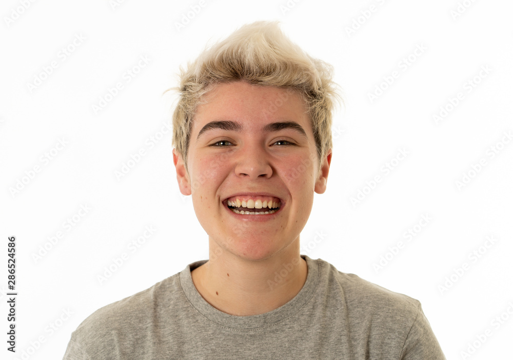 Portrait of attractive cheerful transgender young man with smiling happy face. Human expressions and emotions Portrait of attractive cheerful transgender young man with smiling happy face. Human expressions and emotions