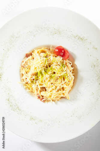 Delicious Spaghetti Carbonara with Grated Parmesan Cheese Isolated