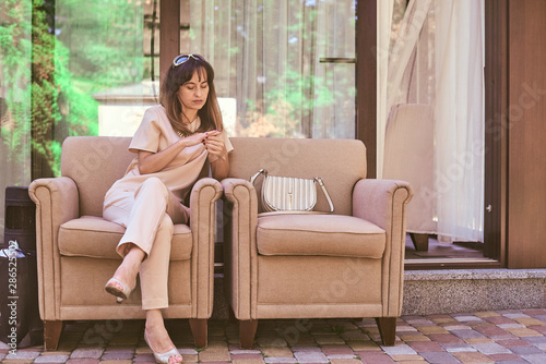 woman on a sofa near a restaurant photo