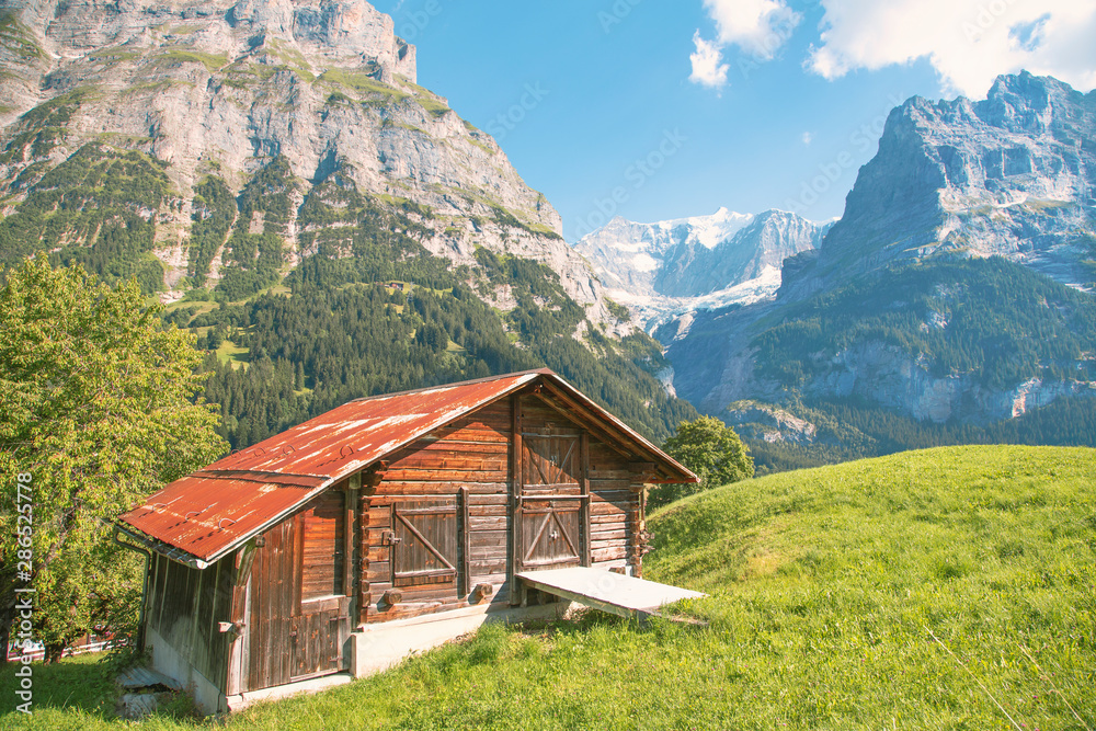 Alpine hut above Grindelwald, Mt Wetterhorn at the back, Canton of Bern, Switzerland