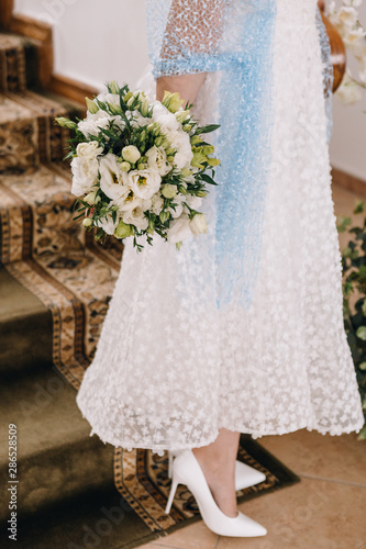 Wedding image and a bridal bouquet with red flowers	