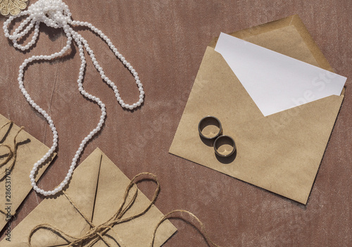 Minimalist wedding arrangement with opened envelope