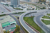 Bridges, roads. Top view . Aerial view of highway and overpass in city .Aerial photo of urban elevated road junction and interchange overpass in city with light traffic