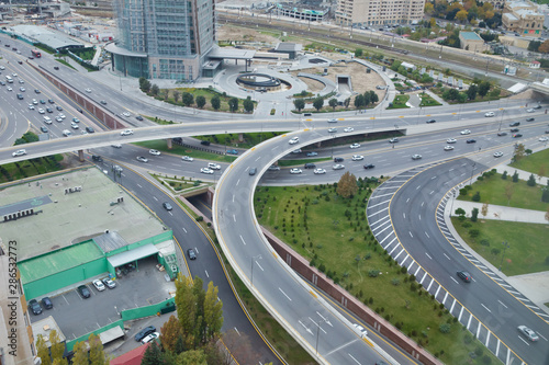 Bridges, roads. Top view . Aerial view of highway and overpass in city .Aerial photo of urban elevated road junction and interchange overpass in city with light traffic