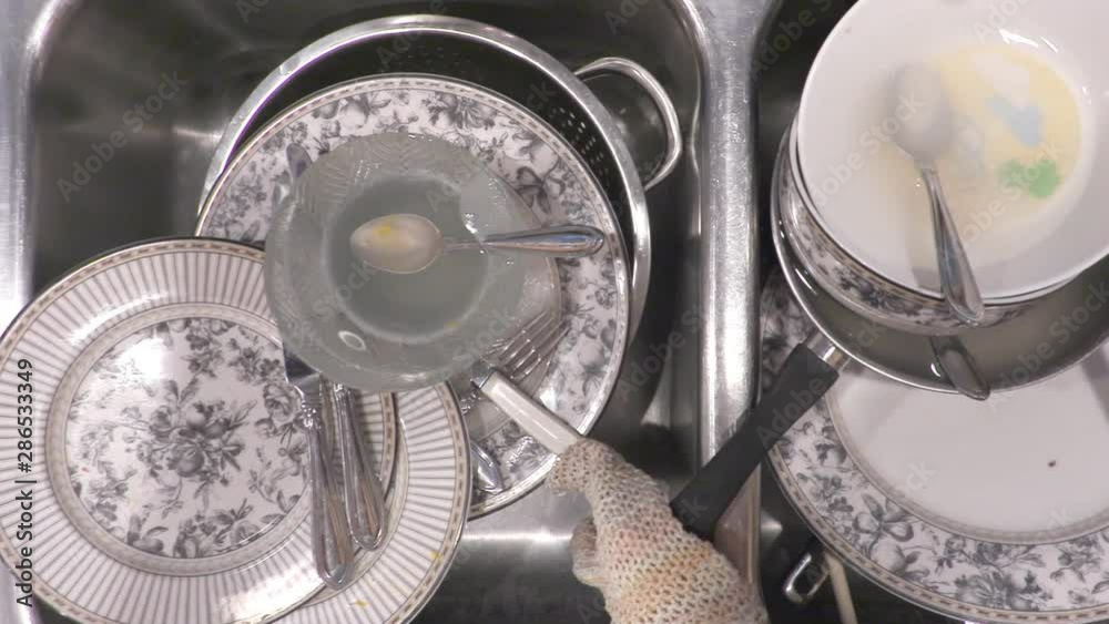 Overhead pan of dirty dishes in kitchen sink Overhead pan of dirty dishes in kitchen sink