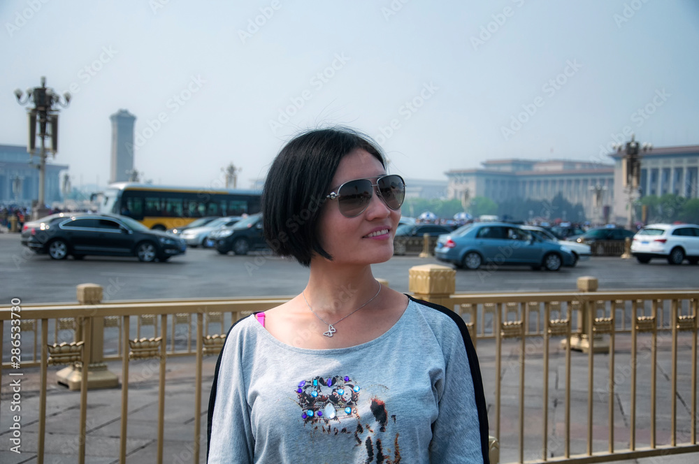 Chinese woman in Tiananmen square beijing china sunny day