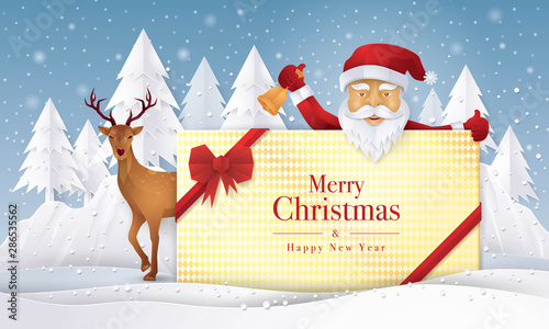 Santa claus and reindeer holding gift with Merry Christmas Greeting Card, © Komate