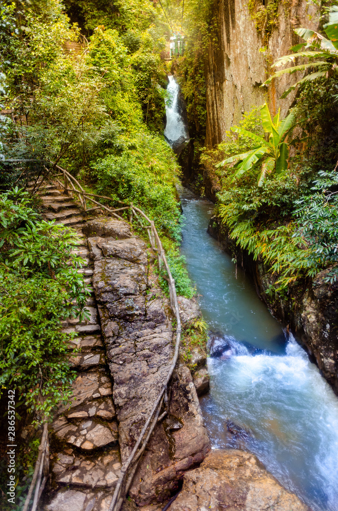 Water fall and stone stairs in forest. Water fall and stone stairs in forest.