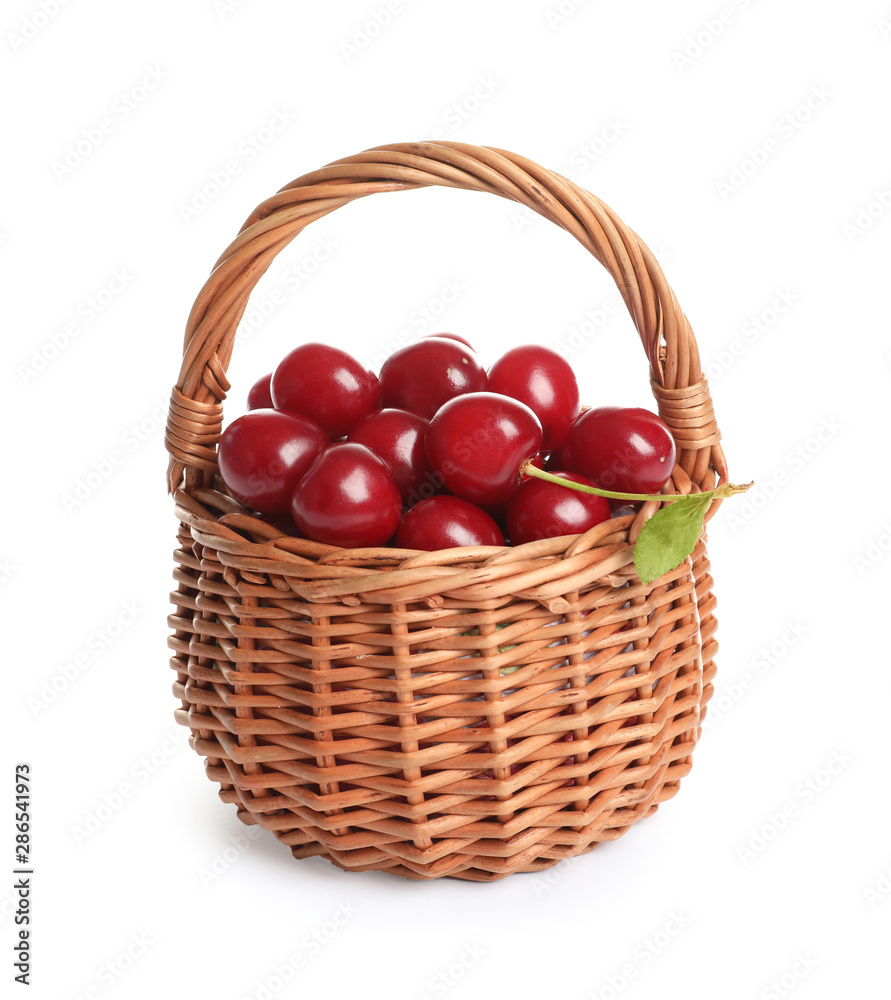 Wicker basket of delicious ripe sweet cherries on white background Wicker basket of delicious ripe sweet cherries on white background