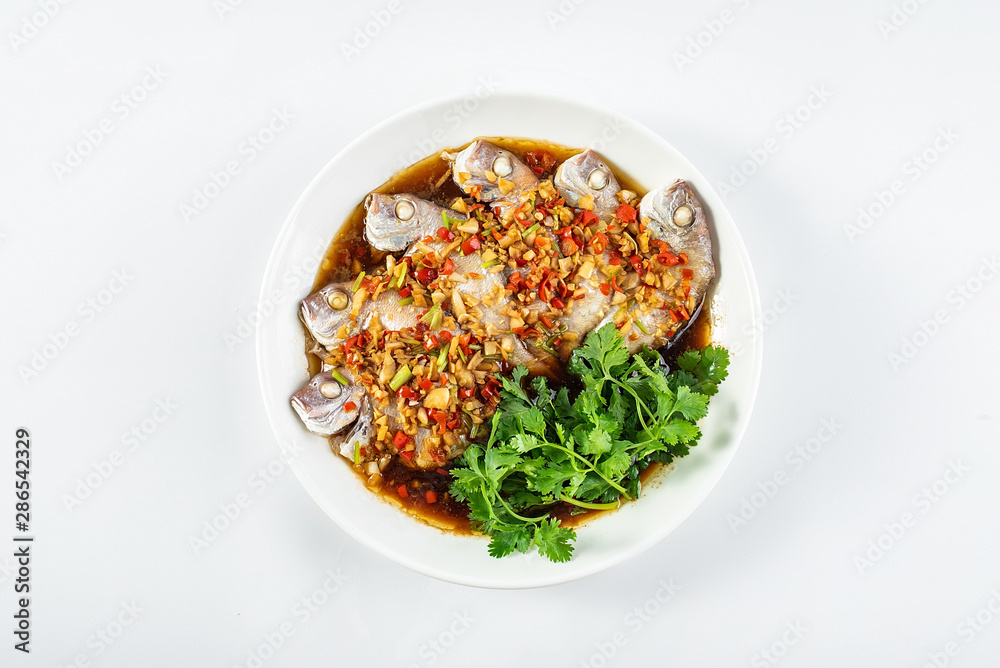 Chinese dish of hot chilli steamed red squid on white background Chinese dish of hot chilli steamed red squid on white background