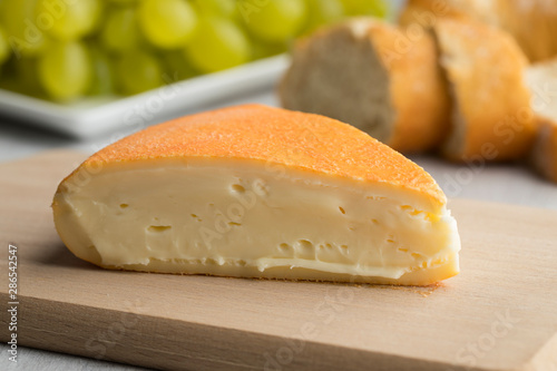  Piece of creamy French Chaumes cheese photo