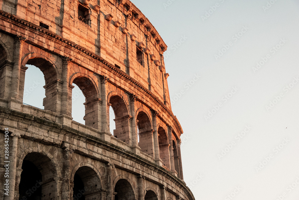 Fototapeta premium Rome Coloseum with beautiful colourful sunset