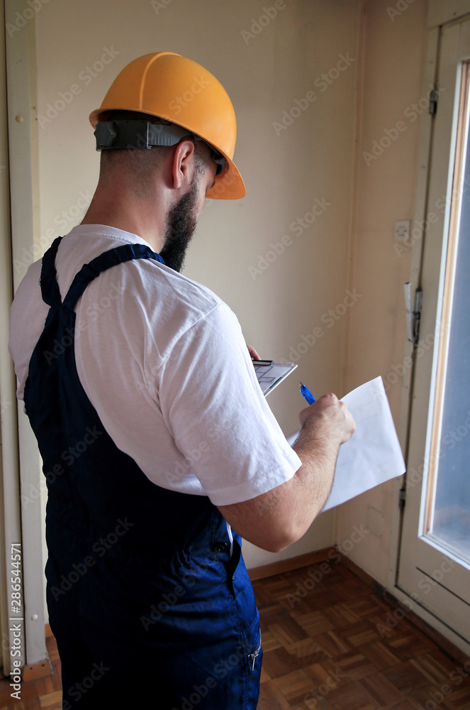 Engineer, contractor or project manager with documents construction is checking construction site. Supervisor in room for renovation with apartment blueprint and conceptual plan interior construction. Engineer, contractor or project manager with documents construction is checking construction site. Supervisor in room for renovation with apartment blueprint and conceptual plan interior construction.