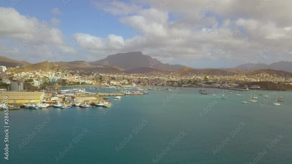 Mindelo City Aerial, Cape Verde, on Volcanic Sao Vicente Island. Waterfront Cityscape and Port of Exotic Destination Mindelo City Aerial, Cape Verde, on Volcanic Sao Vicente Island. Waterfront Cityscape and Port of Exotic Destination