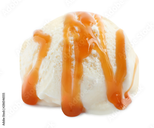 Scoop of delicious ice cream with caramel sauce on white background