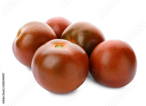 Fresh ripe brown tomatoes on white background