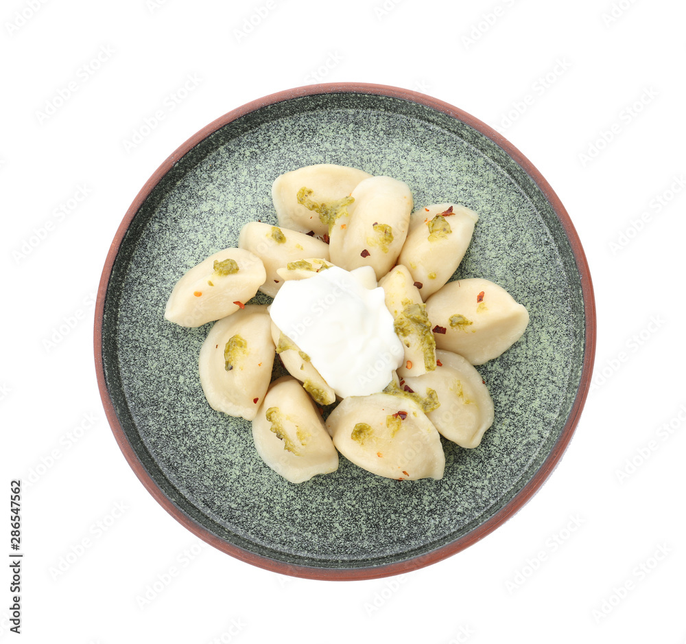 Delicious cooked dumplings with sour cream on white background, top view Delicious cooked dumplings with sour cream on white background, top view