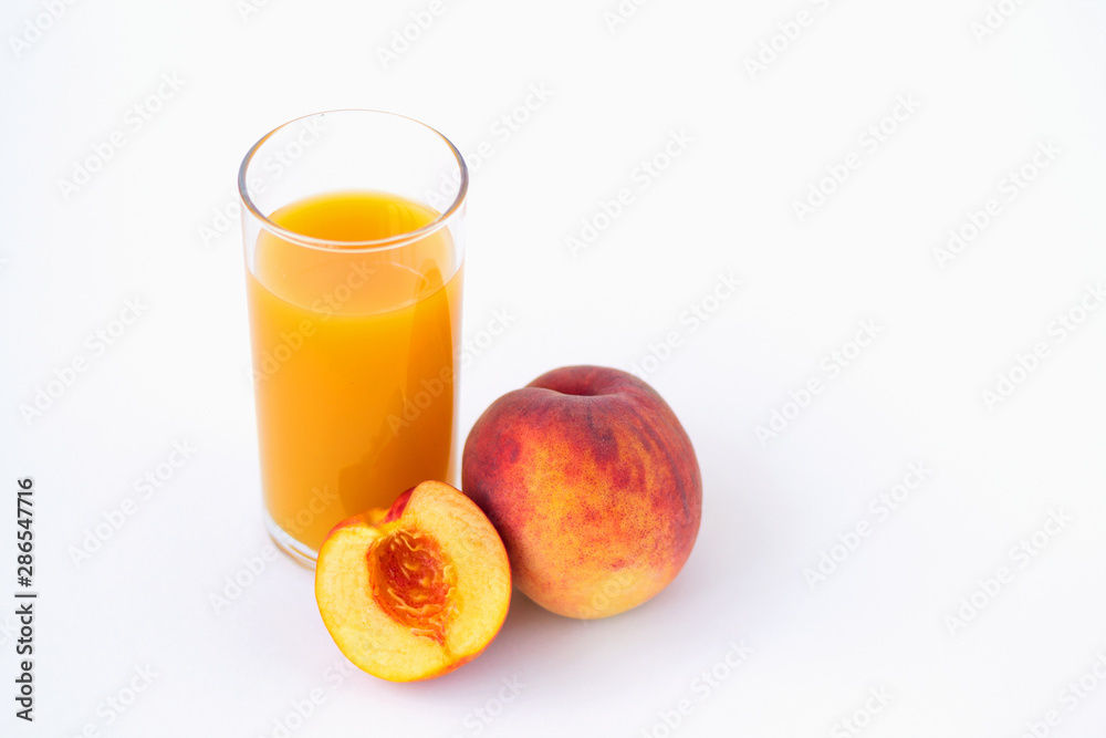 glass of peach juice and fresh fruits isolated on white glass of peach juice and fresh fruits isolated on white