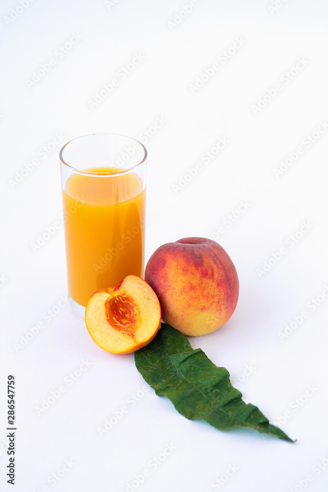 glass of peach juice and fresh fruits isolated on white background glass of peach juice and fresh fruits isolated on white background