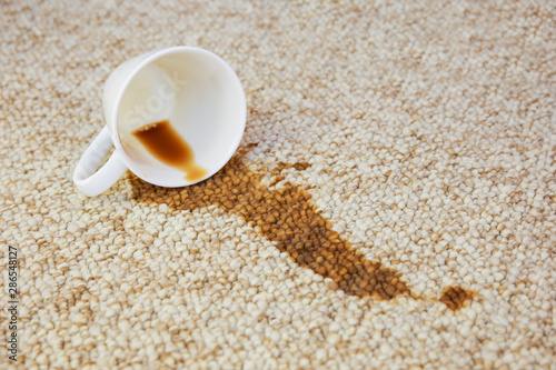 Canvastavla Cup of coffee fell on carpet. Stain is on floor.