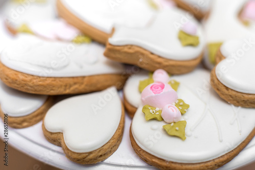 Closeup of gingerbread cookies in a white glaze. Stylish pastries as a decoration for the holidays.