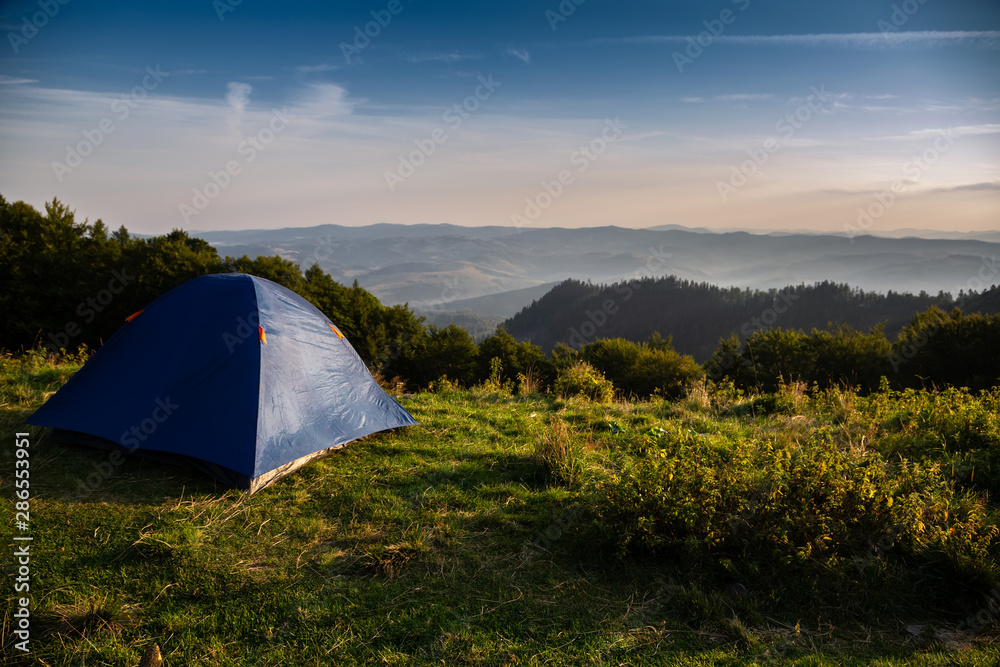 Obraz premium Beautiful mountain landscape with a tourist tent. Carpathian mountains of Ukraine. Holidays in the mountains.