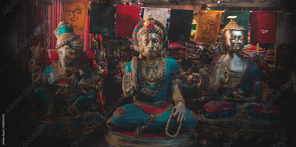 Antique religious statues at a shop. Lord Human, Ganesh and Gautam Buddha.