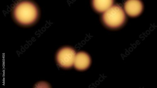 golden glowing blurred lights - beautiful bokeh background - on black (4K)