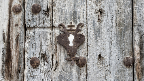 Very old lock on a wood door