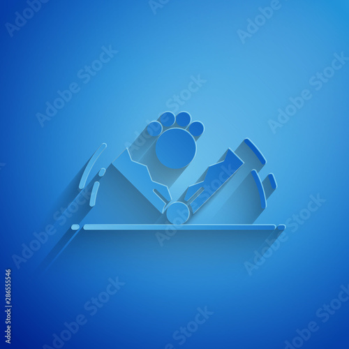 Paper cut Trap hunting icon isolated on blue background. Paper art style. Vector Illustration