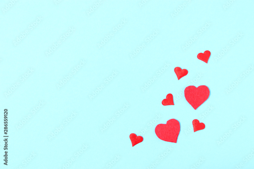 Hearts on a colored background top view. Background for Valentine's Day. Romantic background.