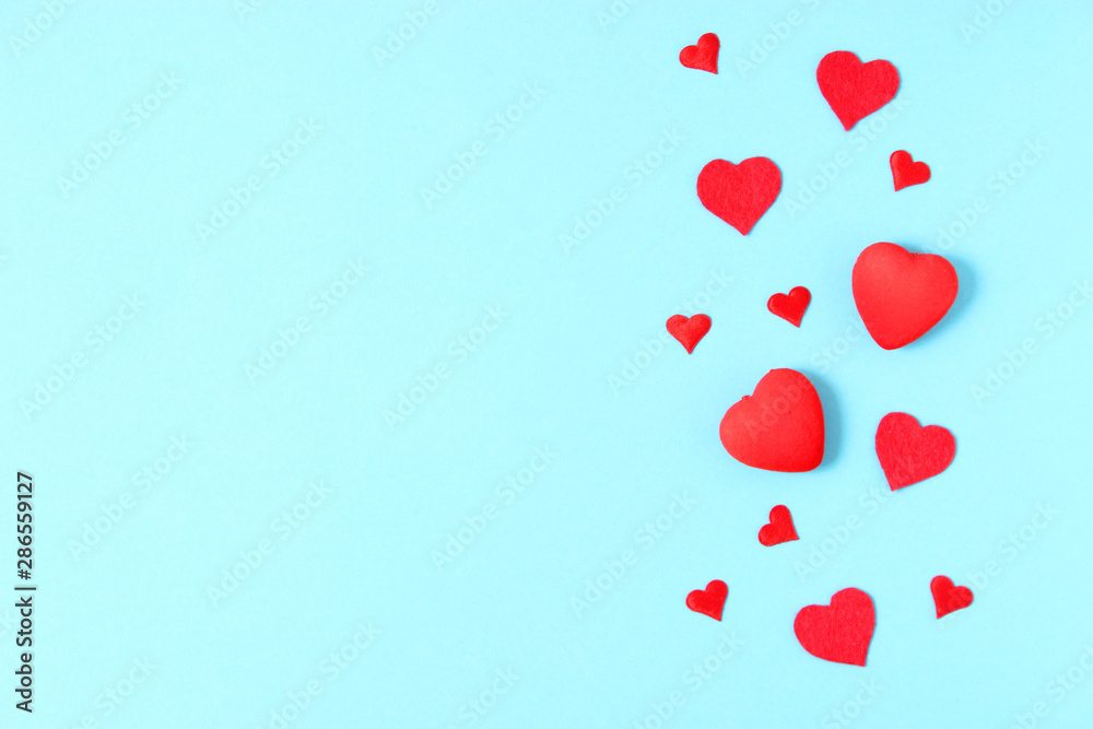 Hearts on a colored background top view. Background for Valentine's Day. Romantic background.