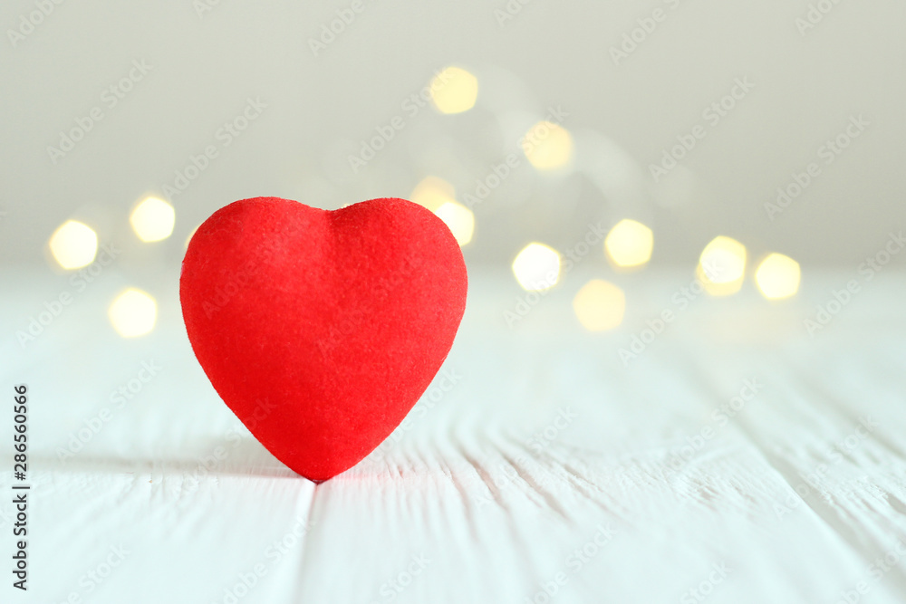 Hearts on the background of the lights of a garland. Background to the day of St. Valentine. Hearts on the background of the lights of a garland. Background to the day of St. Valentine.