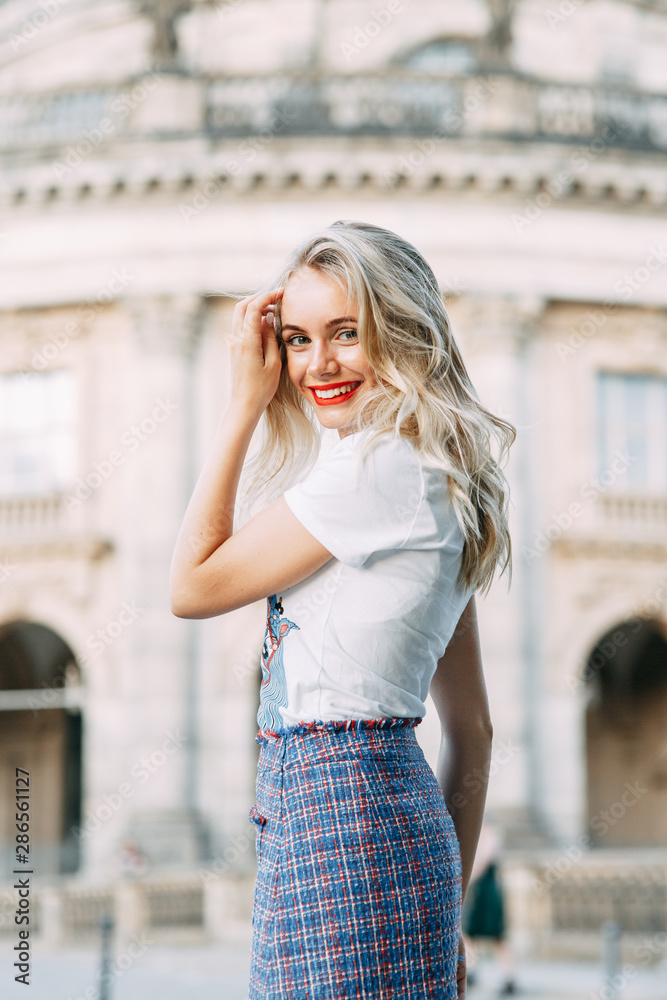 attractions significant places of Germany. beautiful smiling girl in Berlin.