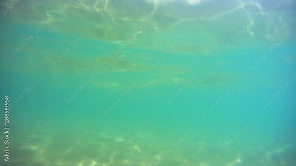 Sun rays and sandy bottom underwater Sun rays and sandy bottom underwater