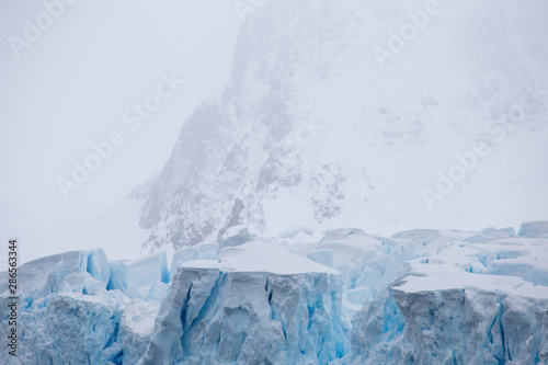 World climate change problems. Melting glacier. Antarctica amazing white frozen blue landscape. Polar snow