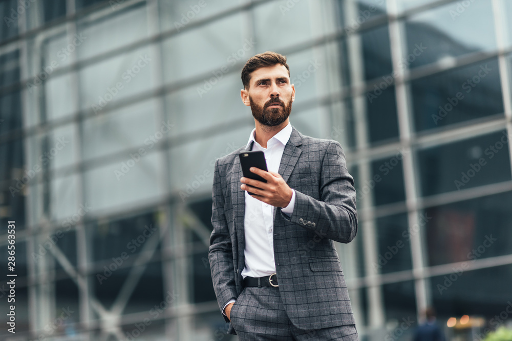 Joyful businessman dancing and talking phone about his new career