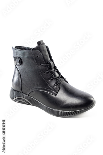 black leather ankle boots isolated on white background