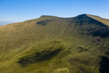 Aerial drone view of the twin peaks of mountains Corn Du and Pen-y-Fan in the Brecon Beacons of Wales, UK
