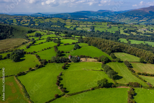 Aerial drone view of farmland and fields in rural Mid Wales, UK photo