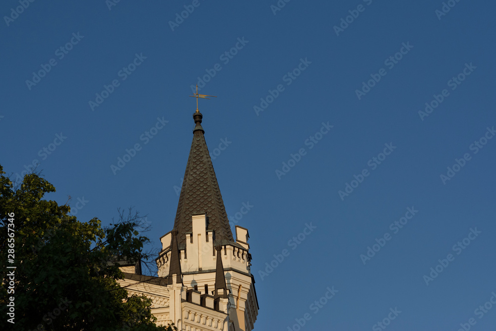 Ancient tower of building on blue sky background