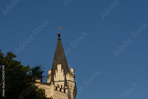 Ancient tower of building on blue sky background