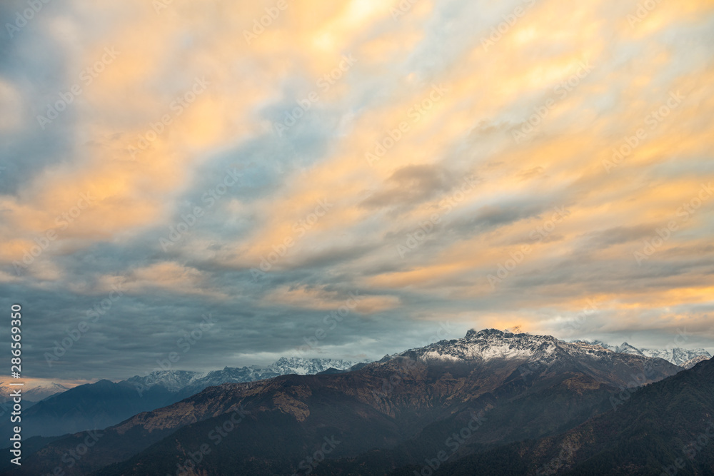 mountain peak cover by cloud at poon hill trekking route