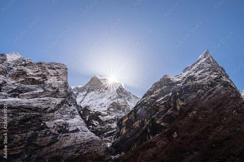 machapuchare peak in himalayas annapurna base camp trekking route with sunlight