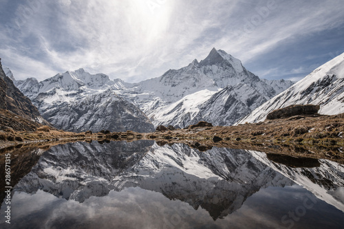 reflection of machapuchare peak in himalayas annapurna base camp trekking route 