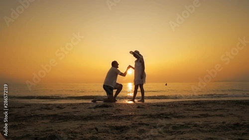 Wallpaper Mural A man proposes on the beach at sunset, SLOW MOTION Torontodigital.ca