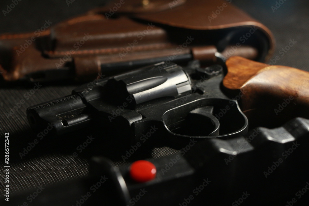 Obraz premium gun on black background