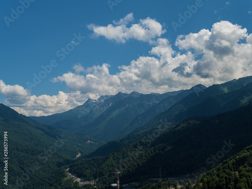 A beautiful view of mountains with clouds . Rosa Khutor © jockermax3d